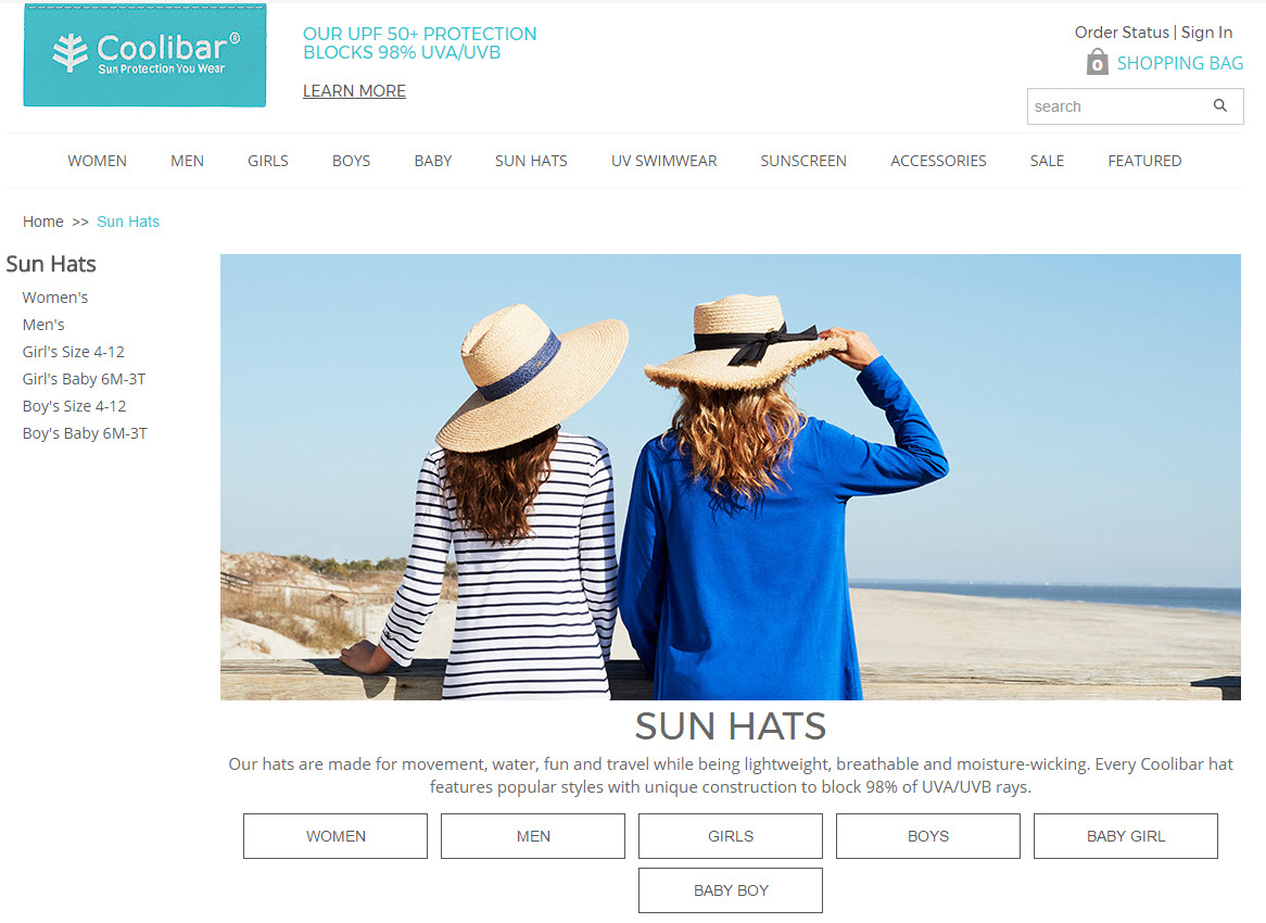 Image of two women wearing sunhats on a beach.