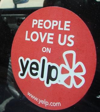 Businesses must qualify to receive the coveted 'People Love Us on Yelp' sticker.