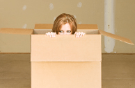 Girl inside cardboard box cropped