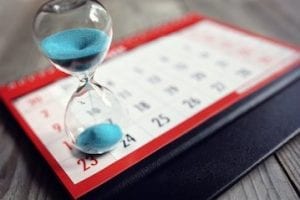 Photo of a calendar with an hour glass