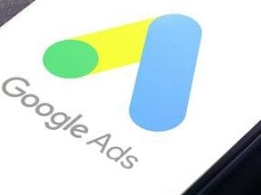 Image of an mobile phone with Google Ads logo on the screen