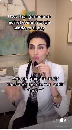Screenshot of a video by a dermatologist reacting to another video related to sunscreen.