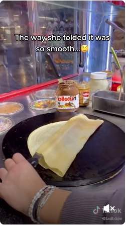 Screenshot of a TikTok user making a crepe from soft cookie dough.
