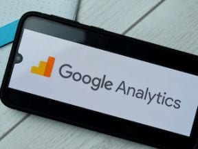 Image of a smartphone with a Google Analytics logo on the screen