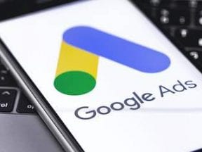 Photo of a smartphone with Google Ads logo on the screen