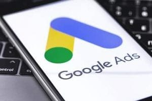 Photo of a smartphone with Google Ads logo on the screen