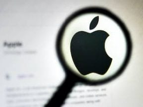 Image of the Apple logo in a magnifying glass