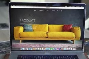 Photo of laptop on a desk with an ecommerce site on the screen