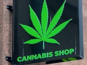 Photo of a retail sign reading "Cannabis Shop"