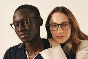 Screenshot from Warby Parker of male and female wearing glasses