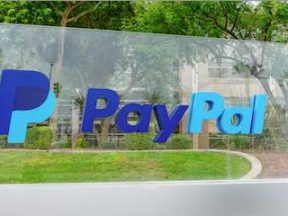 Photo of a PayPal sign in front of an office building