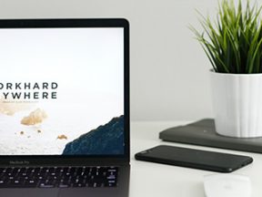 Screenshot of a laptop computer screen with the text "Workhard anywhwere."