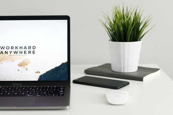 Screenshot of a laptop computer screen with the text "Workhard anywhwere." Screenshot of a laptop computer screen with the text "Workhard anywhwere."