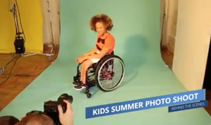 Screenshot of a video on Facebook from Zappos, showing a child in a wheelchair