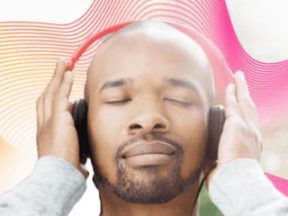 Screenshot of male with headphones from Lucidworks home page