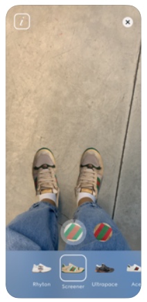 Screenshot on a phone of two feet through the AR feature on the Gucci iOS app