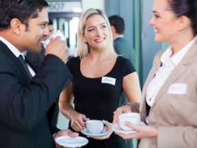 Photo of one male and two females at an in-person networking event