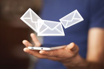 Illustration of a smartphone with email envelopes