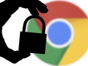 Hand holding lock over Google Chrome logo