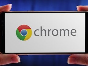 Photo of a smartphone with Chrome logo on the screen