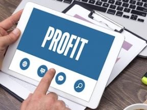 Tablet computer with "Profit" text on the screen