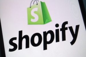 Shopify logo on a smartphone screen