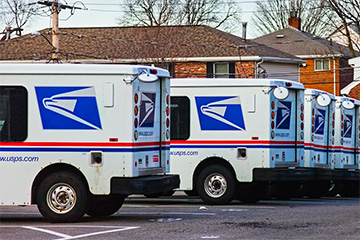 Photo of USPS delivery trucks
