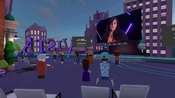 Screenshot of a woman speaking to people virtually in the metaverse.