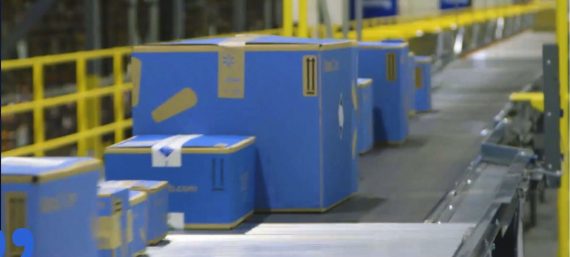 Walmart boxes in a warehouse on a conveyer belt