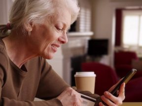 Image of an older female shopping on a smartphone