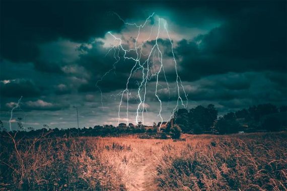 Photo of lightning across a prairie. 