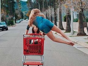 Photos of two girls pushing a shopping cart on a residential street