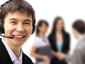 Photo of a male customer service rep wearing a headset