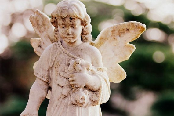 Statue of an angel in white porcelain or marble