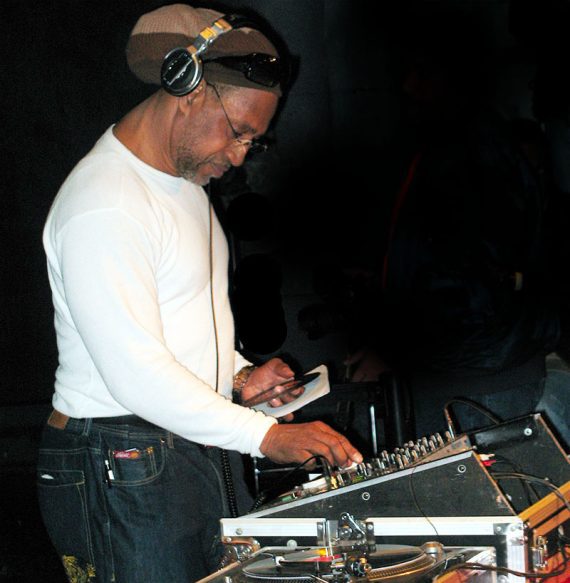 Photo of DJ Kool spinning records.