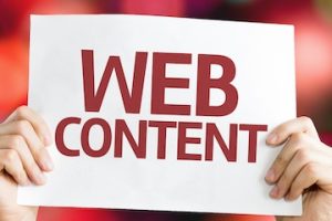 Two humans hands holding a sign, "Web Content."