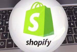 Shopify logo and icon superimposed on a keyboard