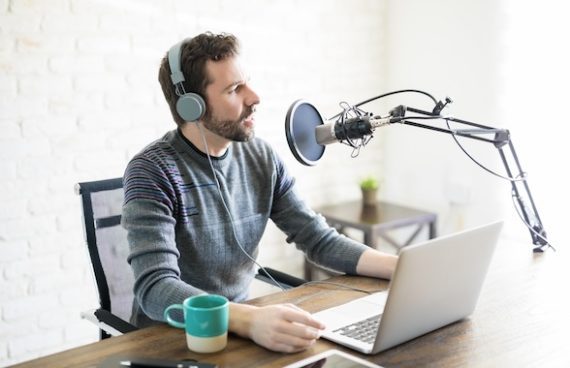 Photo of a male in a podcast setup