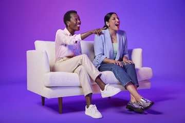 Image from Amazon Ads of two females on a couch watch TV