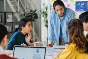 Digital marketers in a meeting around a table