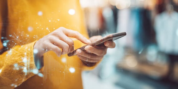 Image showing human hands holding a smartphone. Image showing human hands holding a smartphone.