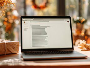 Photo of laptop computer on a desk with holiday decorations