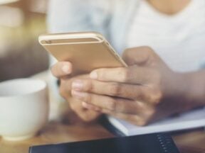 Female hands holding a smartphone