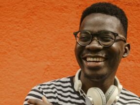 Image from NIQ of a male wearing headphones