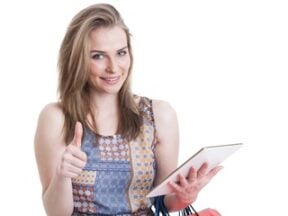 Female with the "thumbs up" sign while holding a computer tablet