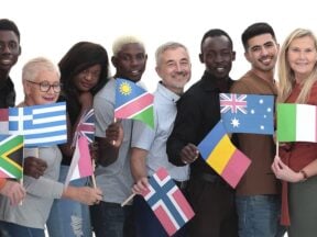 Image of people from different cultures holding flags