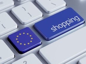 Illustration of the E.U. flag and the word "shopping" on a keyboard