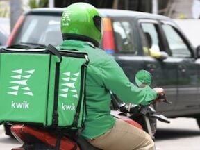 Photo of Kwik delivery agent on a motorcycle