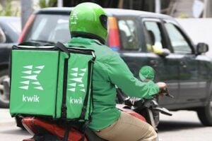 Photo of Kwik delivery agent on a motorcycle