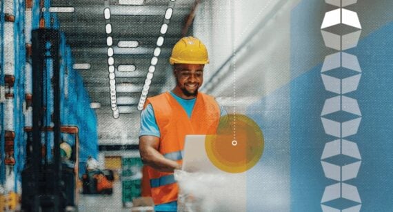 Photo of a warehouse worker in front of a computer Photo of a warehouse worker in front of a computer